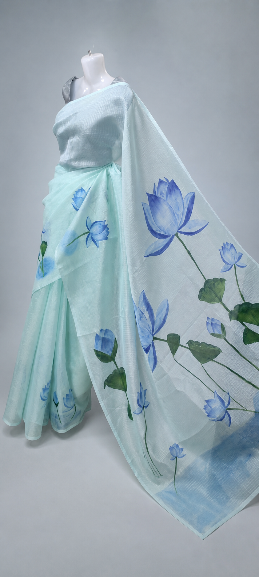 Blue lotus hand-painted Kotta saree in a light-blue studio setting