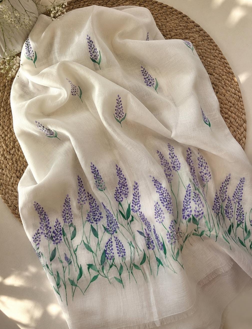 Close view of lavender flowers hand-painted on churidar top material