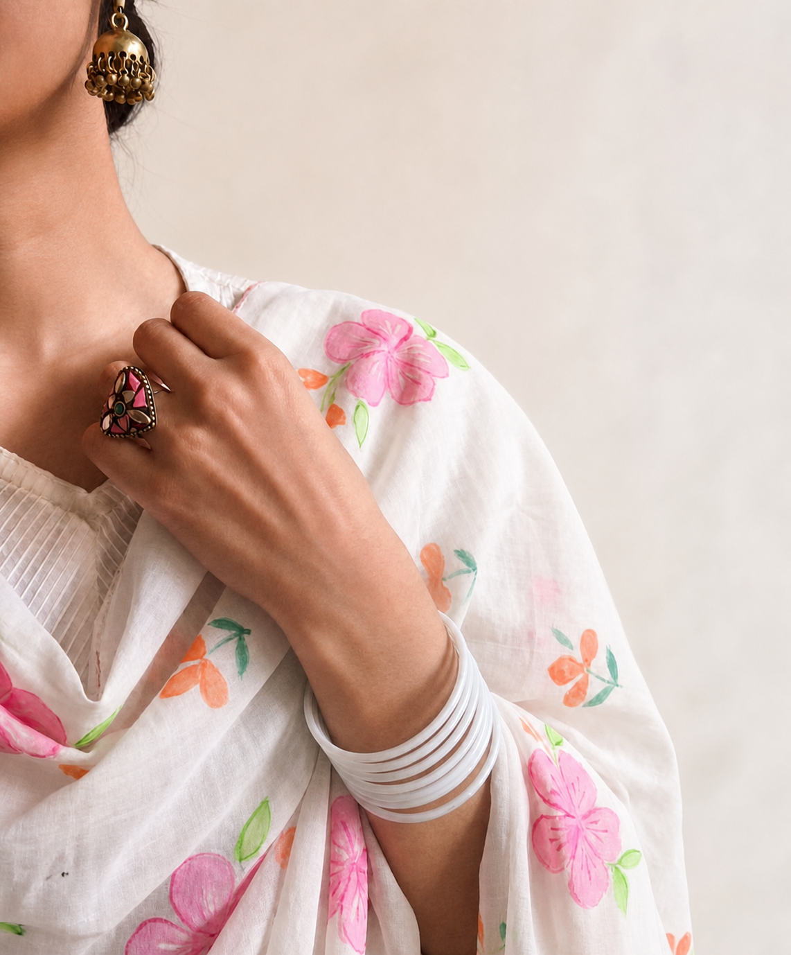 Raahi hand-painted white dupatta worn with pink and peach floral motifs